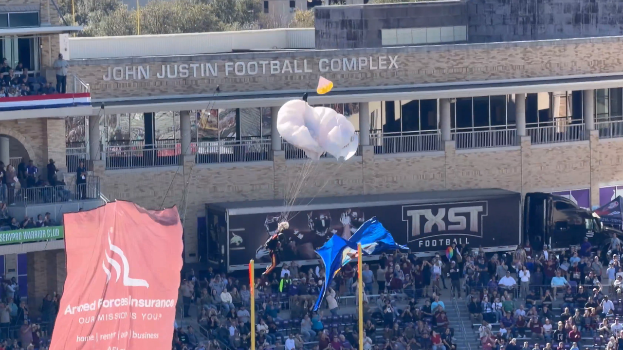 Parachutist takes nasty fall at Fort Worth football game