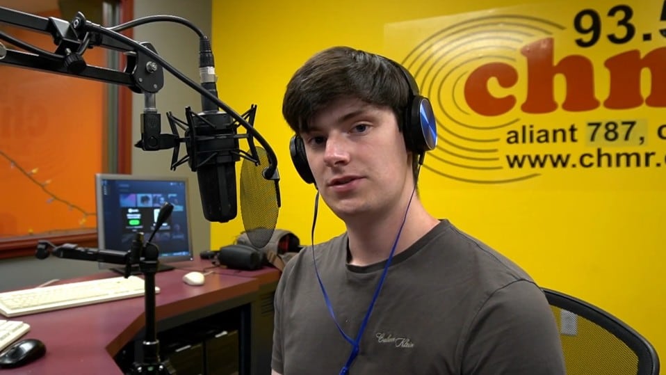 Man sitting in front of microphone