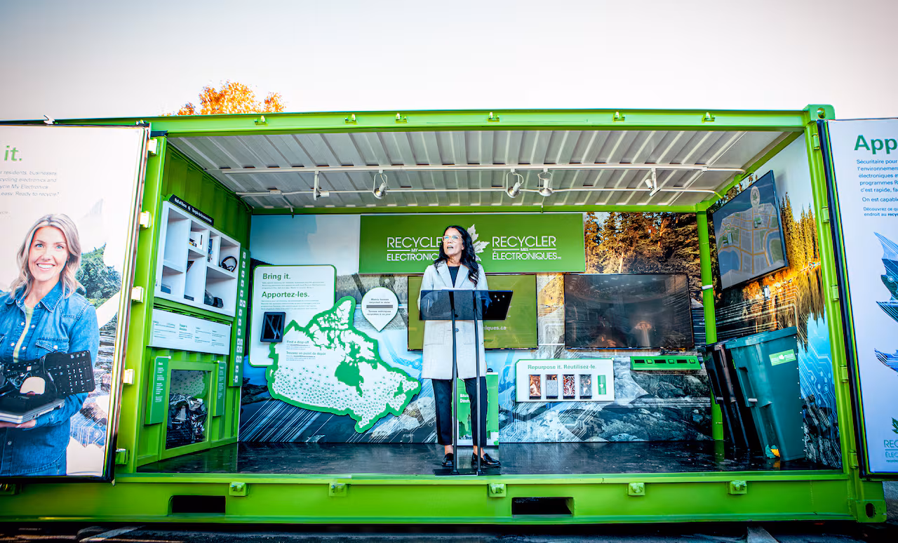 Woman standing at a podium speaking.