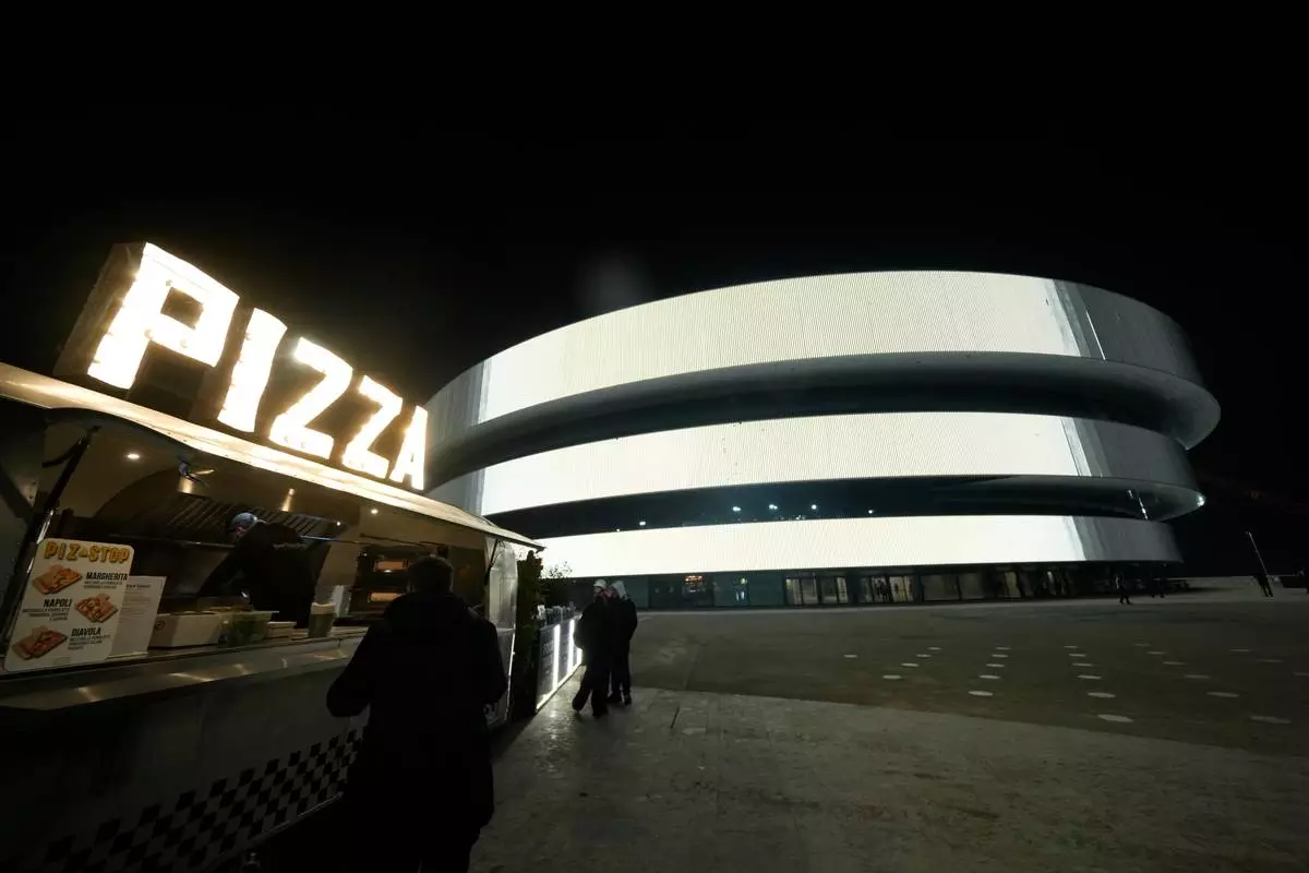 An outside view of the Santa Giulia Ice Hockey Arena, where Ice Hockey discipline of the Milan Cortina 2026 Winter Olympics will take place, in Milan, Italy, Friday, Jan. 9, 2026. (AP Photo/Luca Bruno)