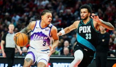Utah Jazz guard Keyonte George (3) drives towards the basket past Portland Trail Blazers forward Toumani Camara (33) during the second half of an NBA basketball game, Monday, Jan. 5, 2026, in Portland, Ore. (AP Photo/Molly J. Smith)