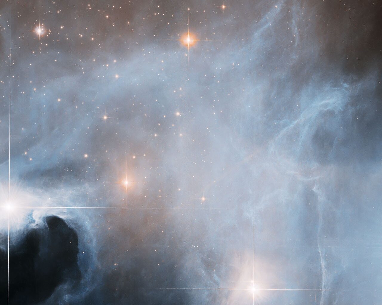 Hubble Observes Ghostly Cloud Alive with Star Formation