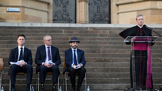 NSW Premier Chris Minns, Prime Minister Anthony Albanese and Rabbi Benjamin Elton listen to Sydney Catholic Archbishop Anthony Fisher at an interfaith ceremony in Sydney on Wednesday.
