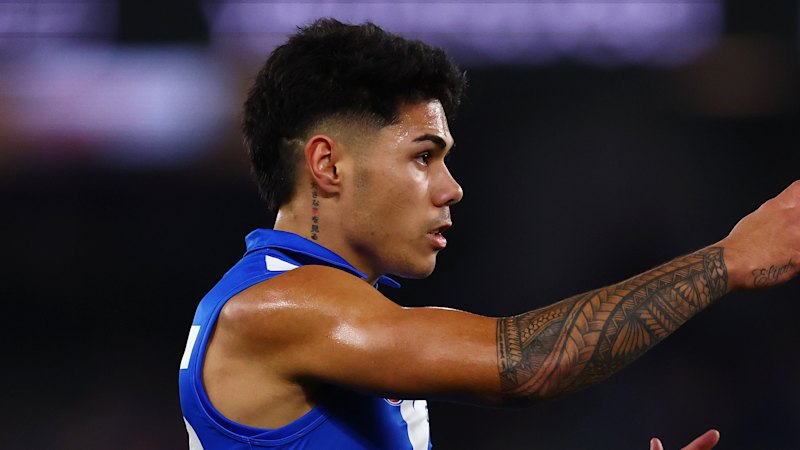 North Melbourne Kangaroos player Paul Curtis recovering from life-saving surgery after emergency dash from Bali