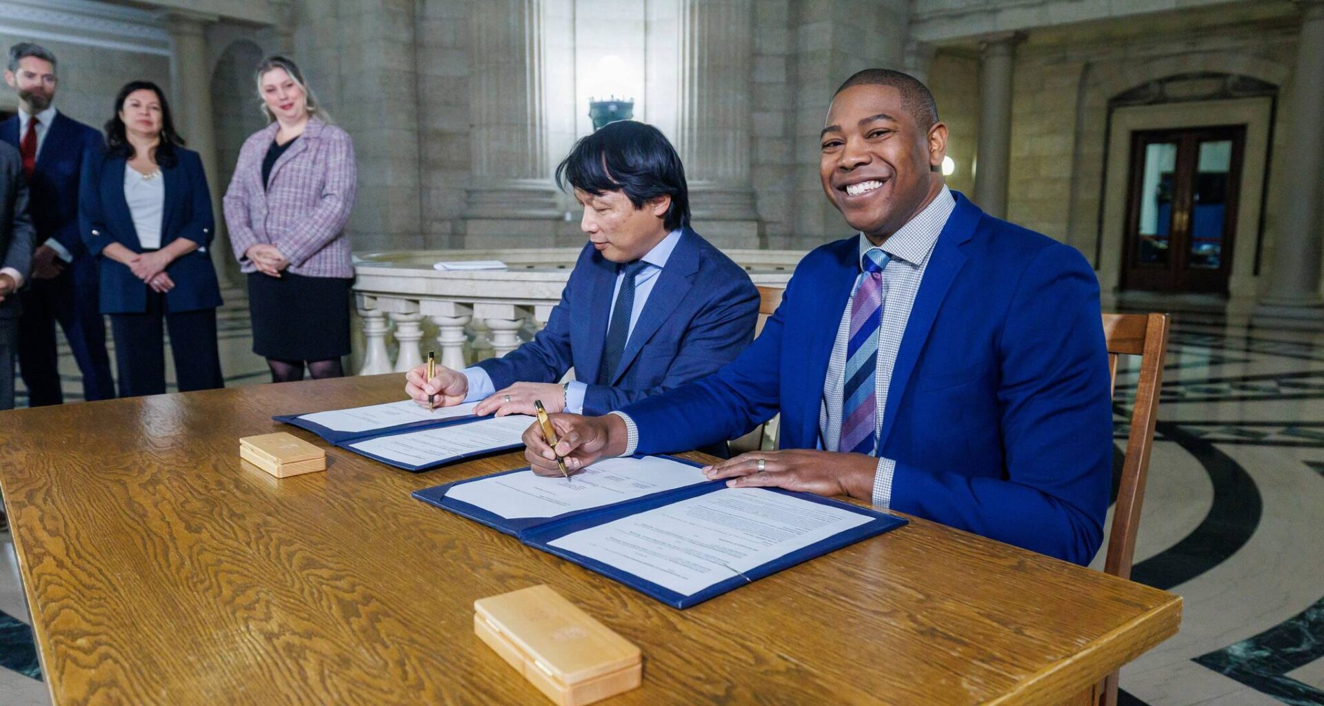 Business, Mining, Trade and Job Creation Minister Jamie Moses (right) and Chris Avery, president and CEO, Arctic Gateway Group sign the memorandum of understanding. (Mike Deal / Free Press)