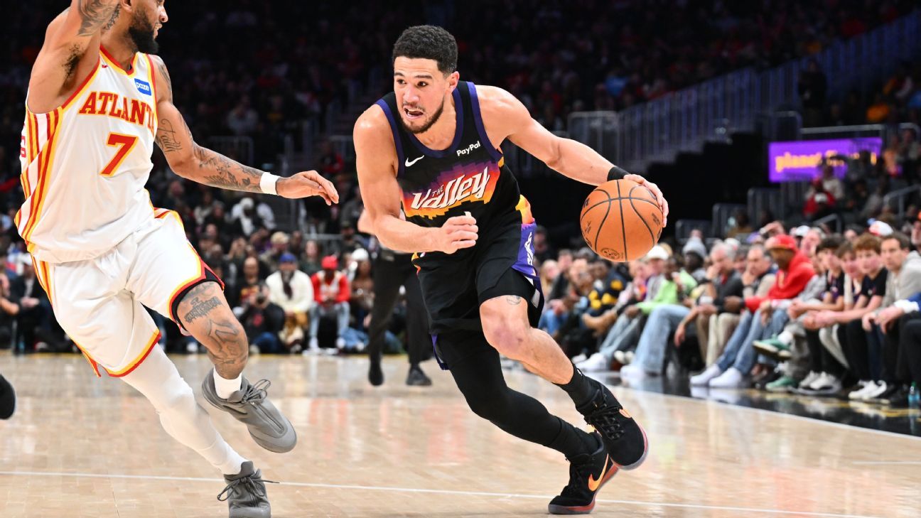 Suns' Devin Booker exits loss to Hawks after rolling right ankle