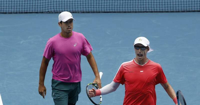 Locals Jason Kubler (L) and Marc Polmans celebrate making the Australian Open men's doubles final. Photo: Rob Prezioso/AAP PHOTOS