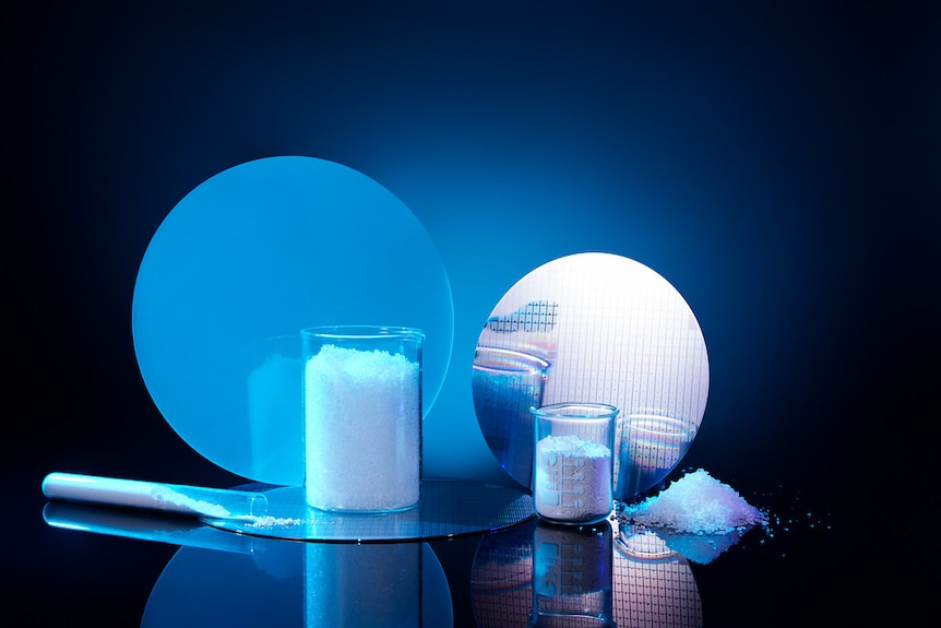 White powder in containers and a computer chip