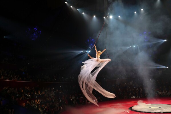An acrobat performs at the Stephane Rolland Spring/Summer 2026 Haute Couture collection presented in Paris, Tuesday, Jan. 27, 2026. (AP Photo/Aurelien Morissard, File)
