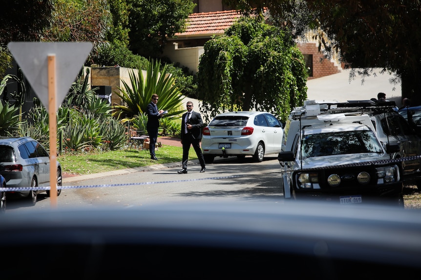 Police officers and vehicles on McCabe Street in Mosman Park. 