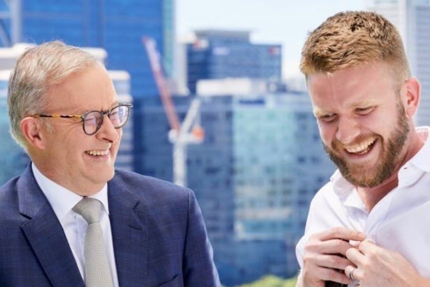 Anthony Albanese and Tim Picton are both smiling as they stand side by side