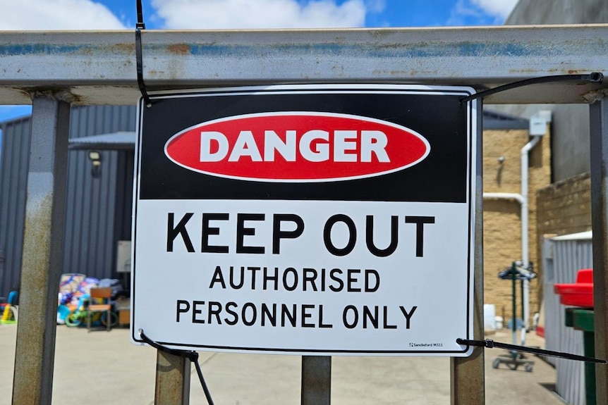 a danger sign saying keep out.