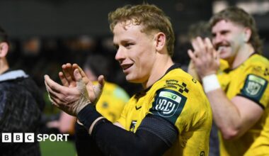 David Richards applauds the Dragons supporters after victory against Scarlets
