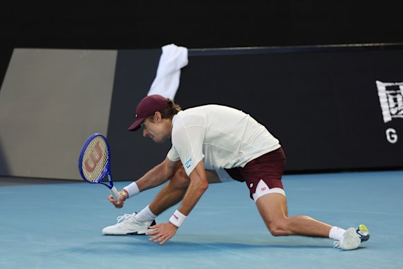 Alex de Minaur stretches for a return.