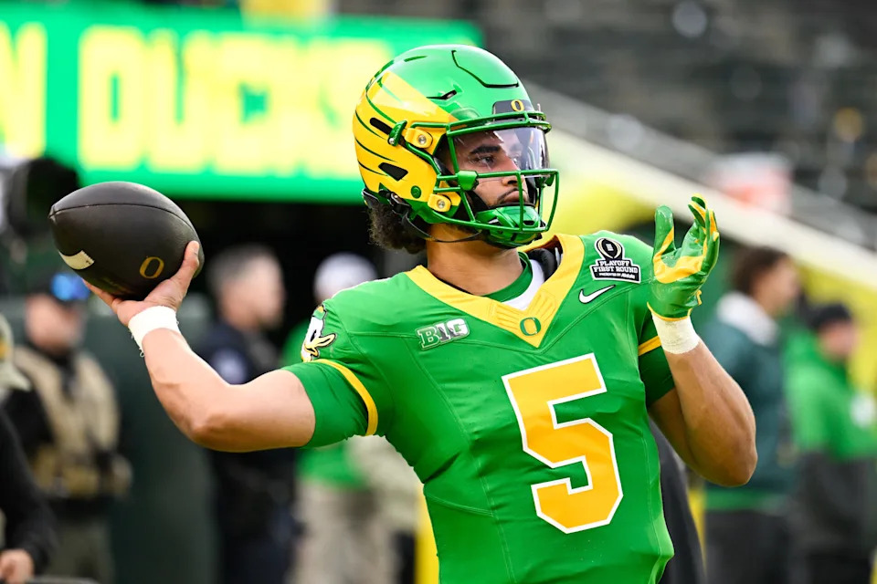 Oregon Ducks quarterback Dante Moore (5) warms up before the game against the James Madison Dukes at Autzen Stadium in Eugene, Oregon on Dec. 20, 2025.