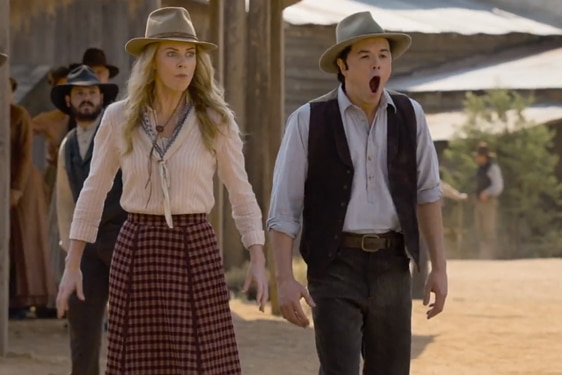 A woman and man in western style gear. 