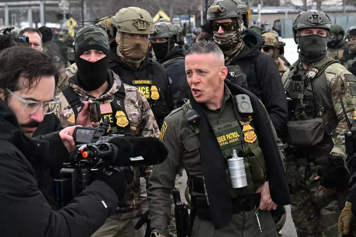 U.S. Border Patrol Cmdr. Gregory Bovino arrives as protesters gather outside the Bishop Henry Whipple Federal Building, Thursday, Jan. 8, 2026, in Minneapolis, Minn. (AP Photo/Tom Baker)