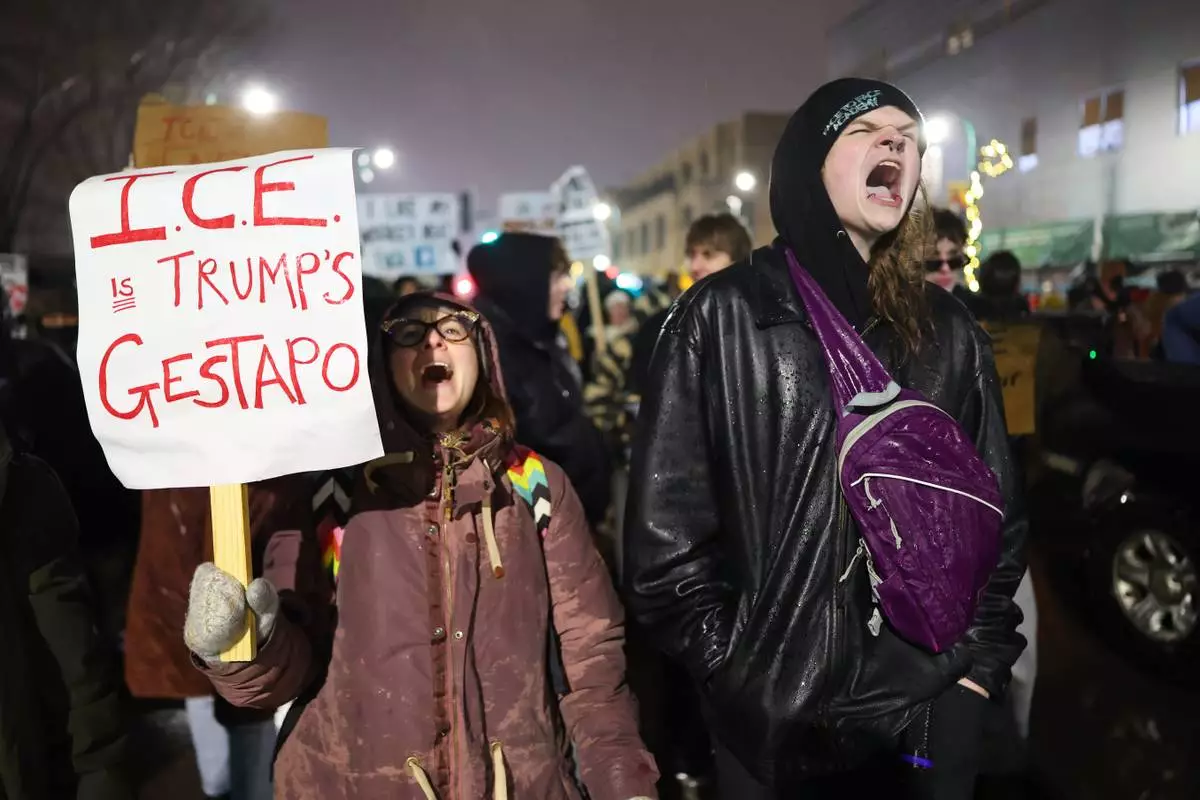 Protesters gather during a rally for Renee Good, Thursday, Jan. 8, 2026, in Minneapolis, after she was fatally shot by an ICE officer the day before. (AP Photo/Adam Bettcher)