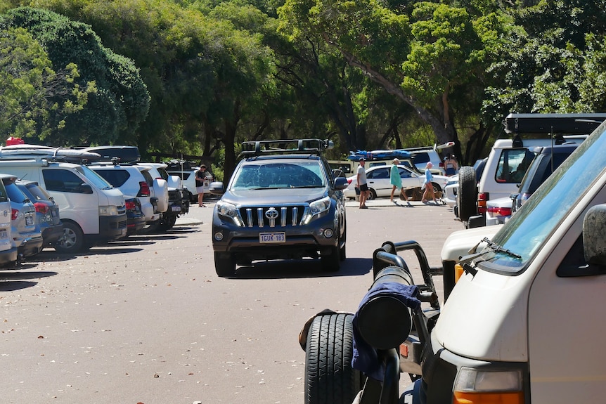 A car in a packed car park