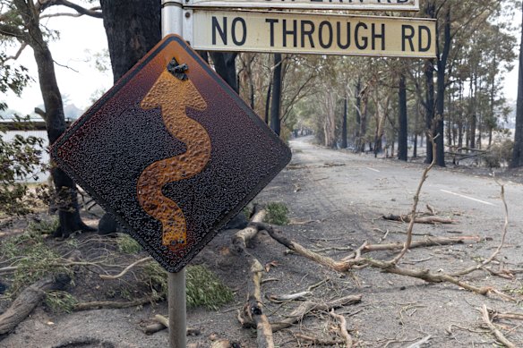 A fire-damaged road sign near Longwood on Saturday.