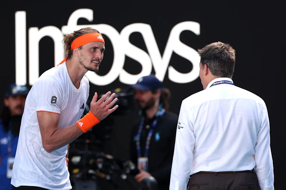 Alexander Zverev talks to a match official.