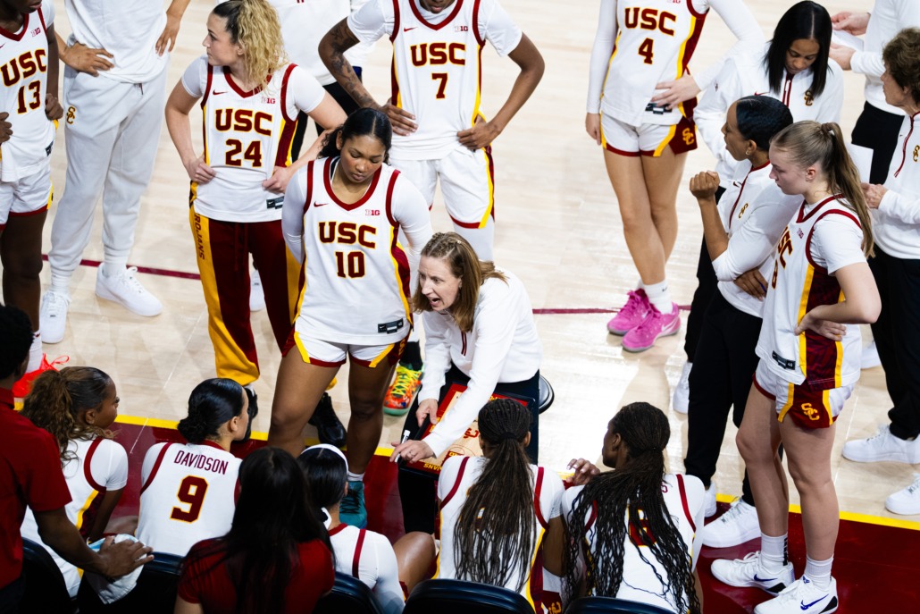 USC women's basketball huddles during a timeout