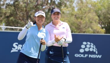 A picture of Camilla Kim and Lara Thomsen holding their hands up smiling