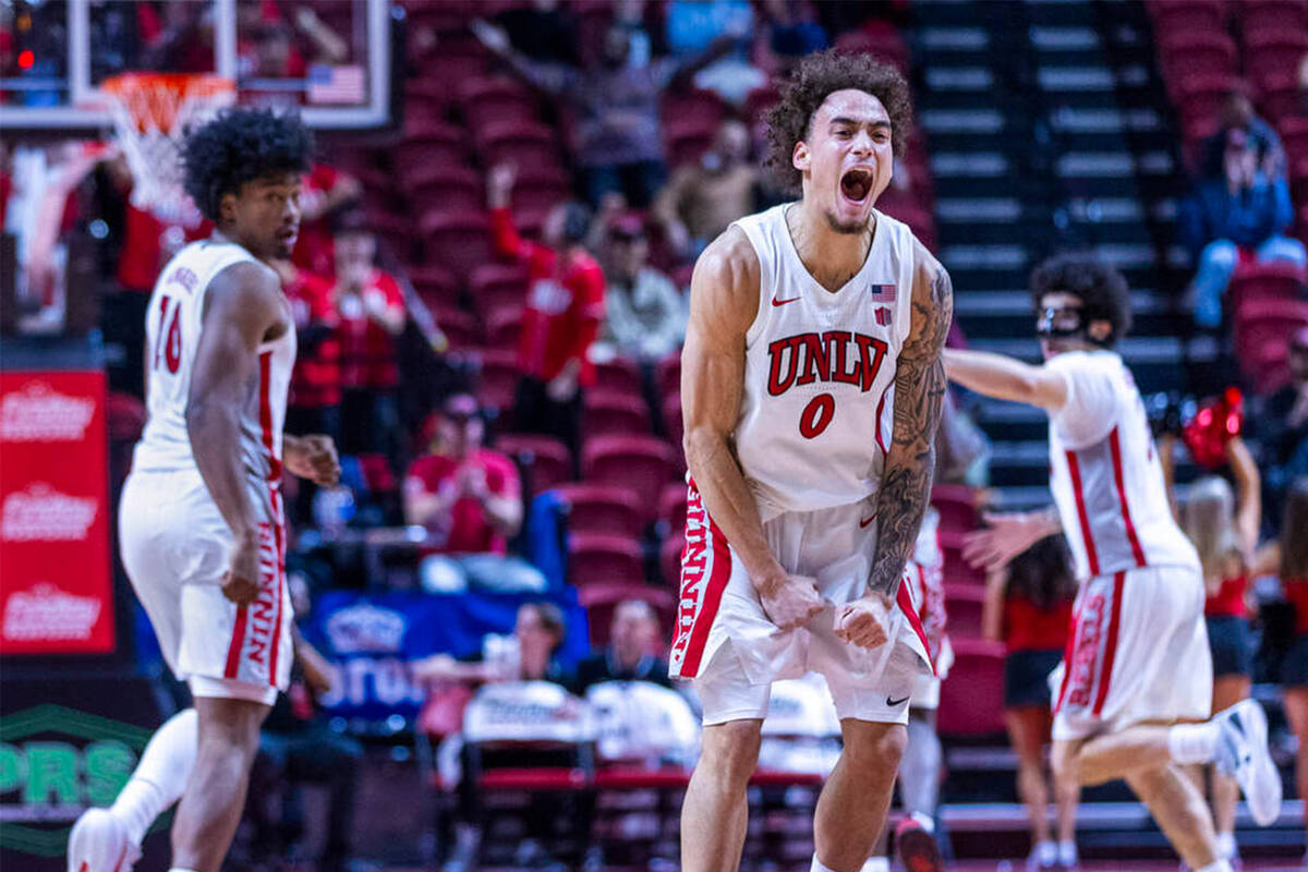 UNLV guard Dra Gibbs-Lawhorn (0) is pumped up as he hits a three-point basket and adds to their ...