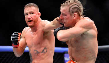 Justin Gaethje, left, punches Paddy Pimblett in an interim lightweight title fightduring the UF ...