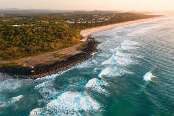 Angels Beach near East Ballina has been closed after a surfer was knocked off their board by a shark.