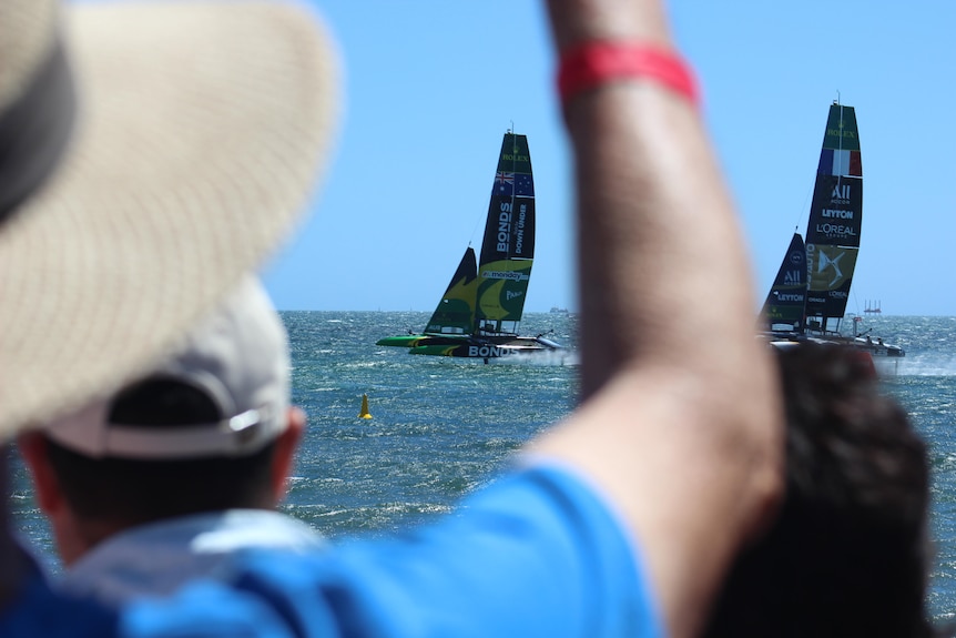 Boats racing on water. 