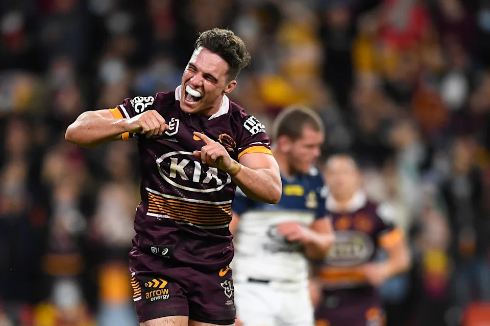 Brodie Croft celebrates after scoring a try.