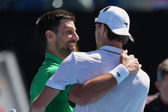 Djokovic and Maestrelli in a friendly embrace post-match.