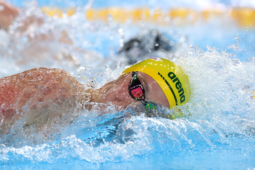 Sam Short swimming in the pool.