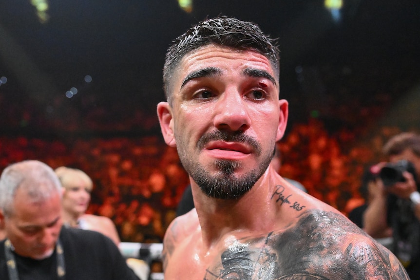 A man with brown hair is shown to have a cut over his right eye