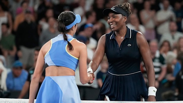 Olga Danilovic, left, of Serbia is congratulated by Venus Williams of the U.S. following their first round match at the Australian Open tennis championship in Melbourne, Australia, Sunday, Jan. 18, 2026. (AP Photo/Aaron Favila)