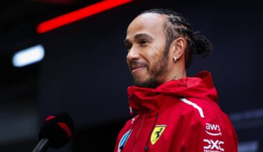 Lewis Hamilton talks into a mic