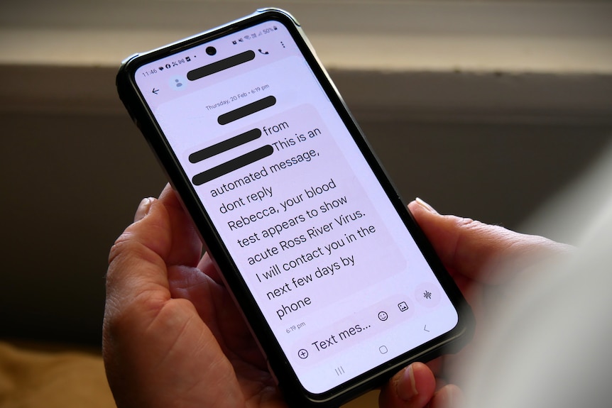 a phone with a text message that says your blood test results appear to show Ross River Virus.