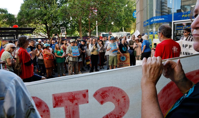 A group of protesters gather outside the US Consulate on St Georges Terrace in the city. 