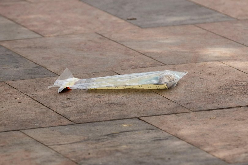 Police set up a perimeter around this bag, although its contents or relevance are unconfirmed. 