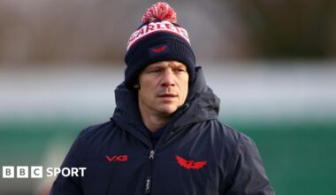 Dwayne Peel in coat and hat pre-match