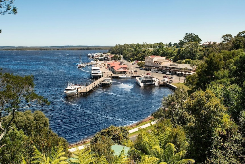 View of Strahan town on river.