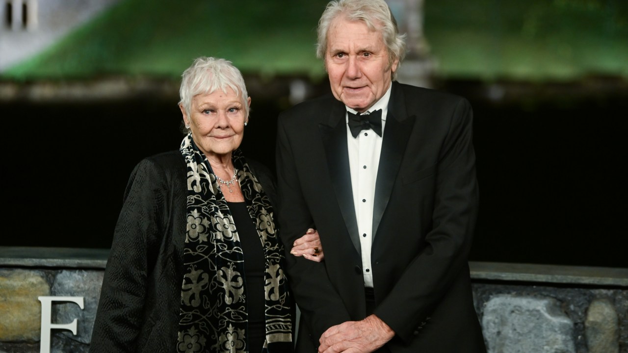 'I can't see anything': Heartbreaking red carpet moment shows depth of 91-year-old Dame Judi Dench's health battle as fans slam 'cruel' photographers