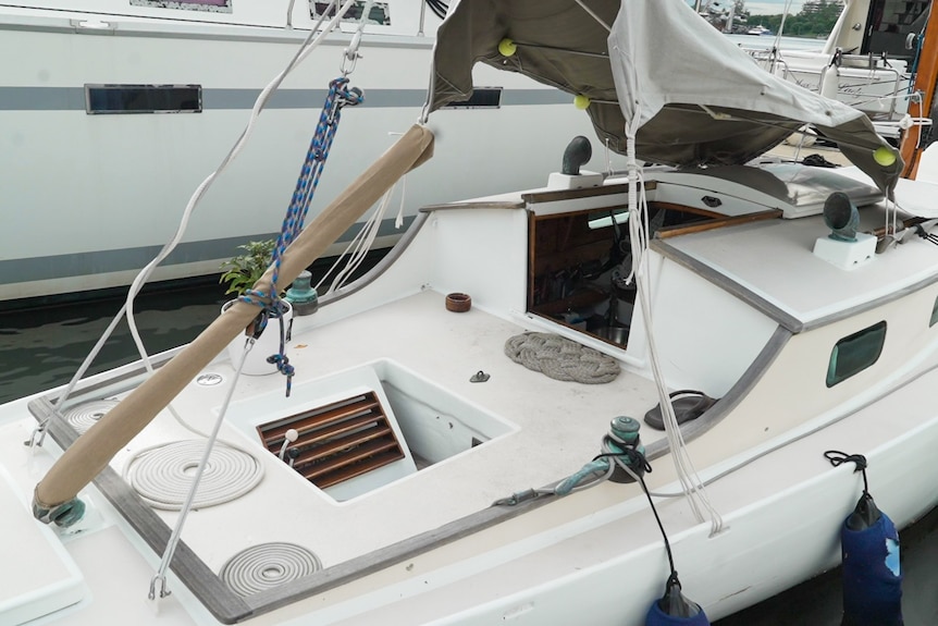 A photo of a small yacht moored in a marina