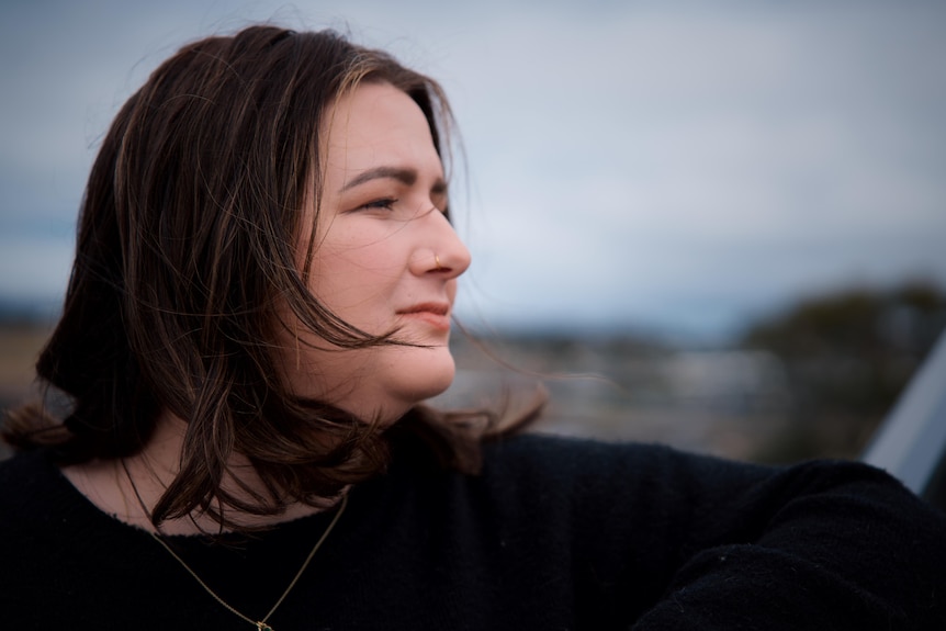 Erin Bell looking into the distance.