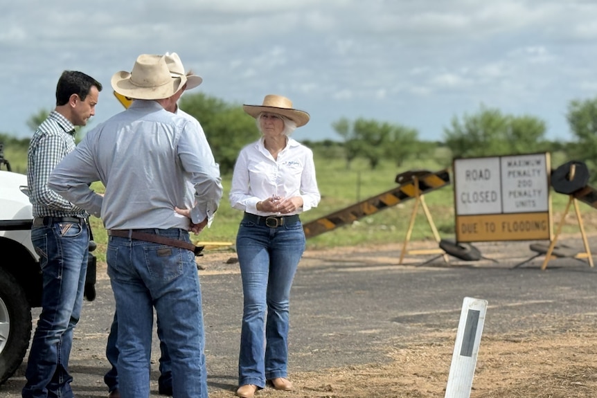 Politicians standing on a road