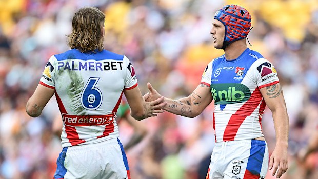 Fletcher Sharpe and Kalyn Ponga of the Knights.