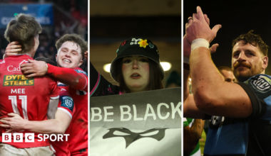 Scarlets players celebrate, as Ospreys fan with a protest banner and Alun Lawrence of Cardiff applauding fans
