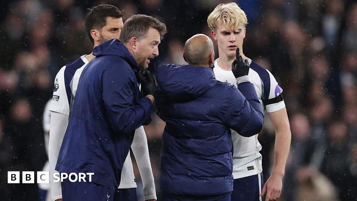 Lucas Bergvall of Tottenham Hotspur is treated by medical staff before he goes off with a concussion injury