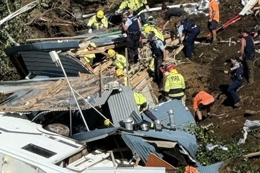 Emergency services comb through wreckage